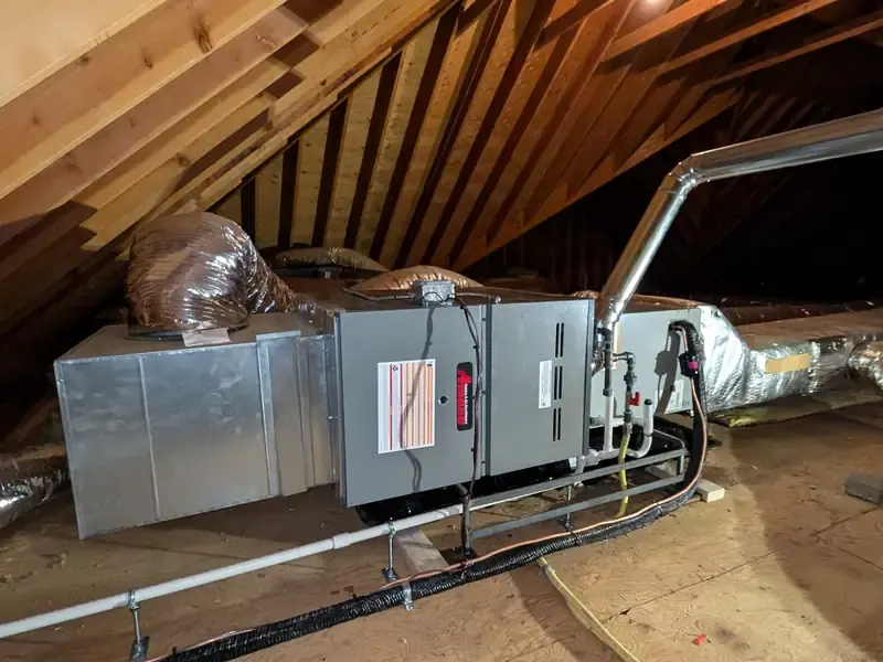 Amana 80% AFUE gas furnace installation between attic rafters in Southern NH