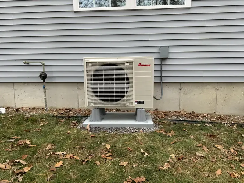 Amana ductless mini split heat pump outdoor unit installed at a Southern NH home