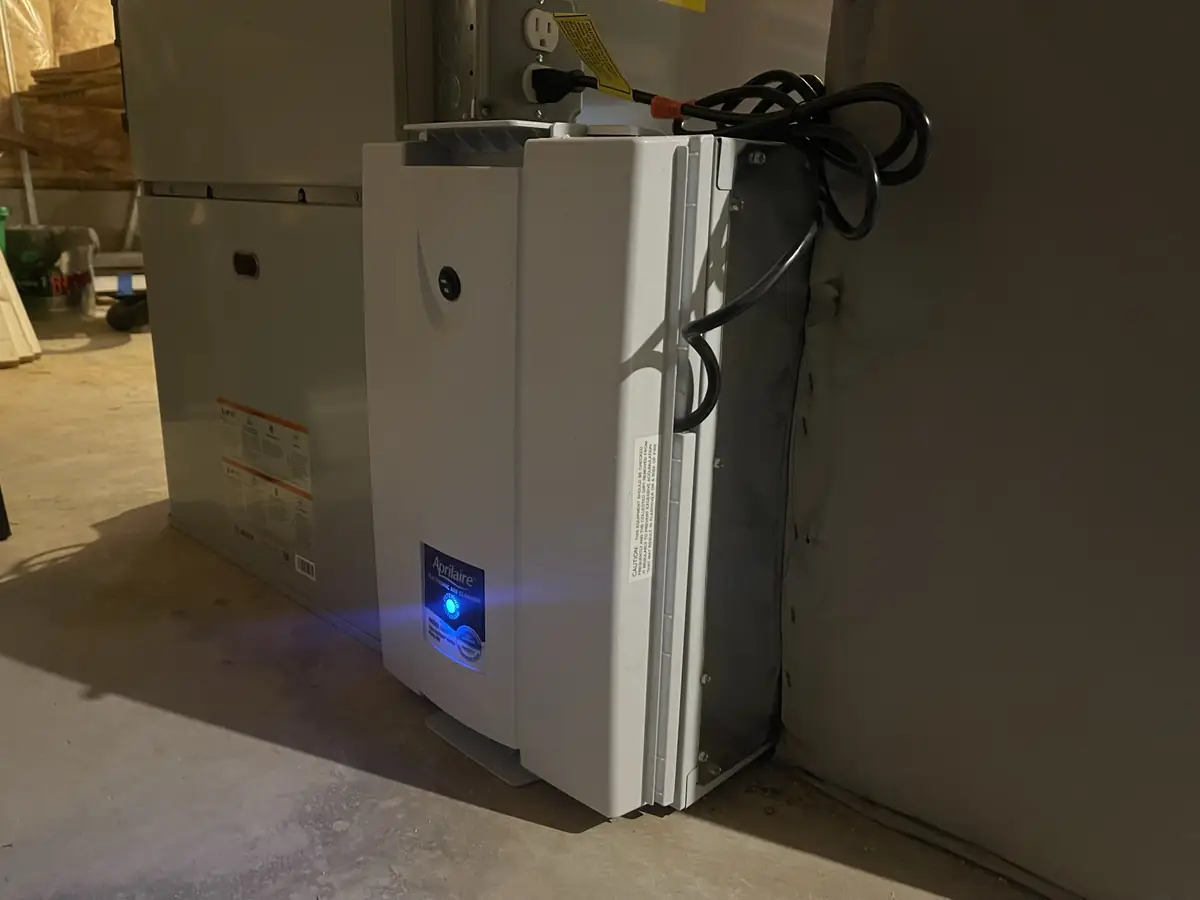 AprilAire Model 5000 electronic whole-home air cleaner installed on HVAC ductwork in a Southern New Hampshire home