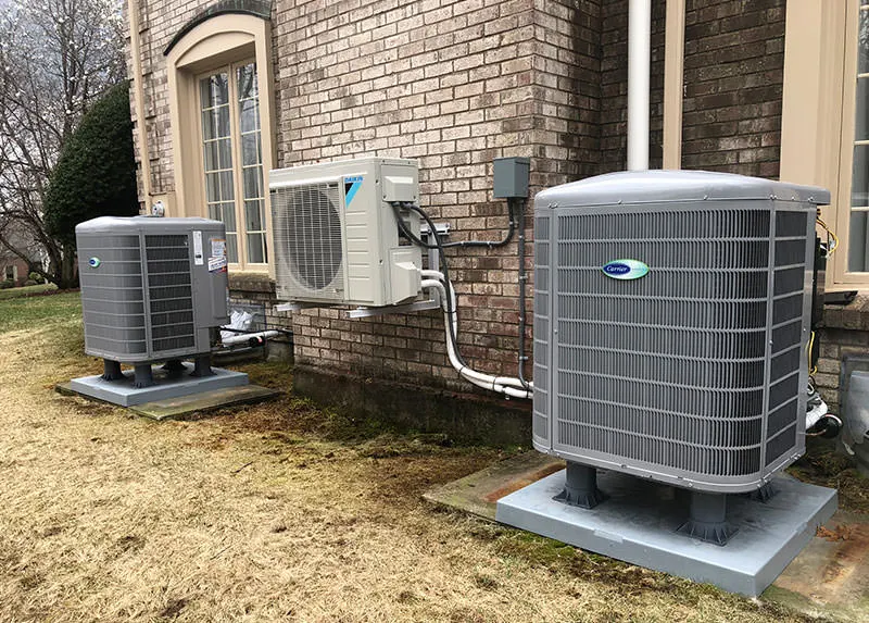 Two Conventional Carrier A/C Condensers with a Daikin ductles heat pump