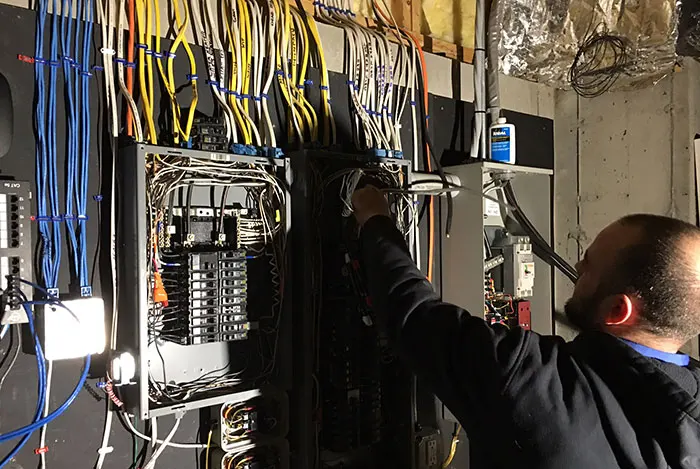 A.J. LeBlanc master electrician working on electrical panel upgrades