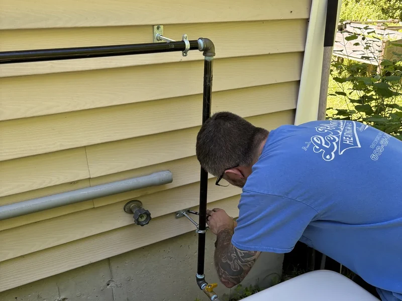 A.J. LeBlanc Heating technician connecting the natural gas supply line to a whole-home standby generator at a Southern NH home