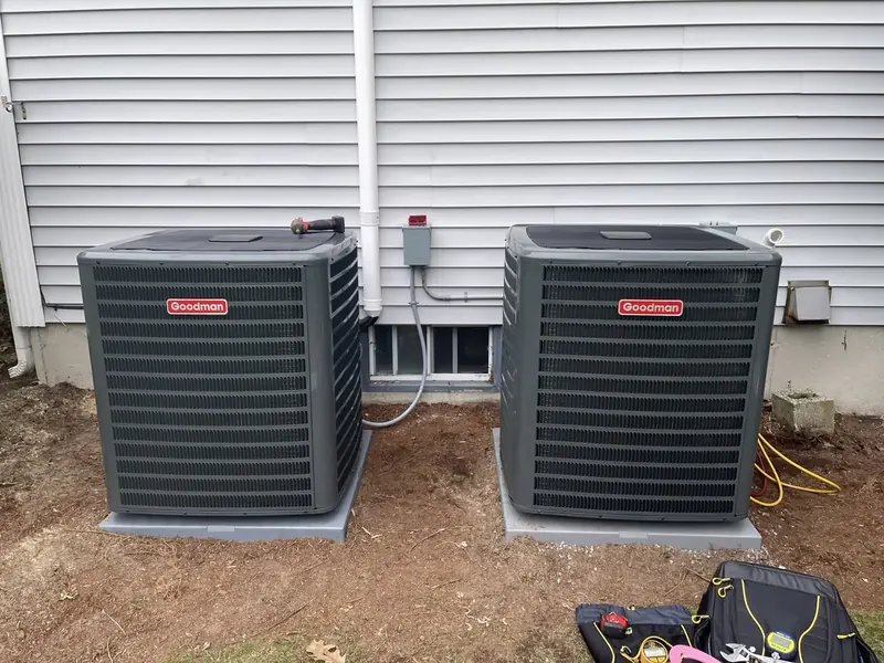 Dual Goodman central air conditioner condensers installed side-by-side at a Southern NH home by A.J. LeBlanc Heating