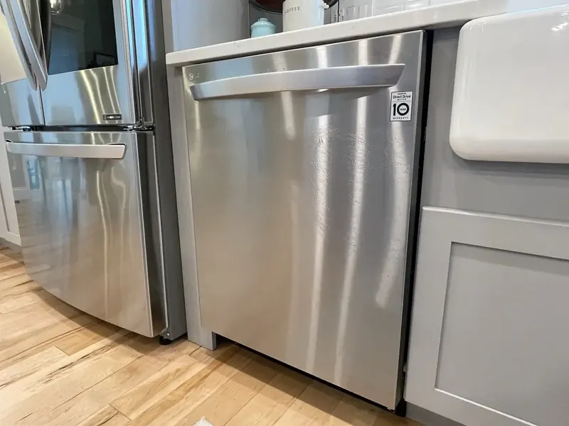 LG stainless steel dishwasher hooked up by A.J. LeBlanc Heating in a Southern NH kitchen
