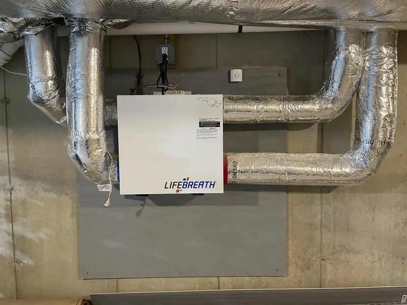 Lifebreath ERV ventilator installed in a Southern NH basement with insulated ductwork by A.J. LeBlanc Heating