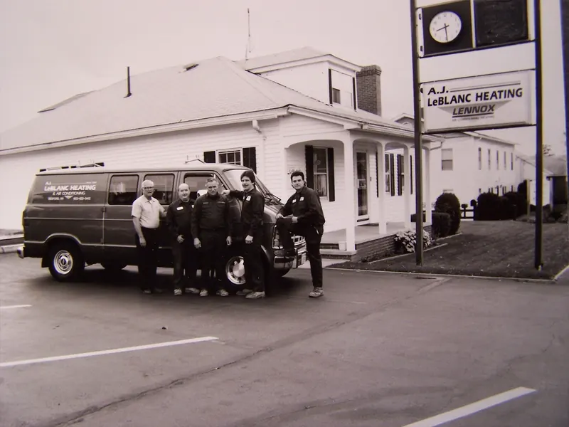 A.J. LeBlanc Heating technicians with a service van