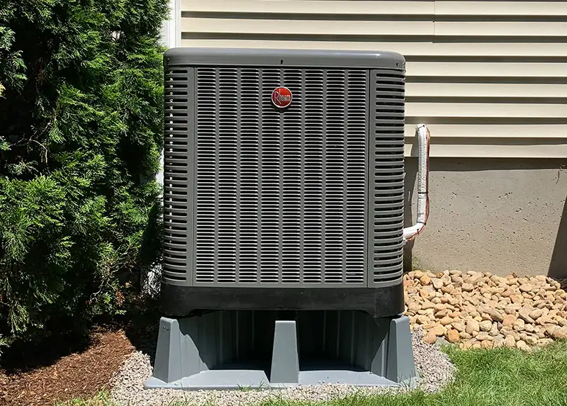 Rheem heat pump on a snow stand