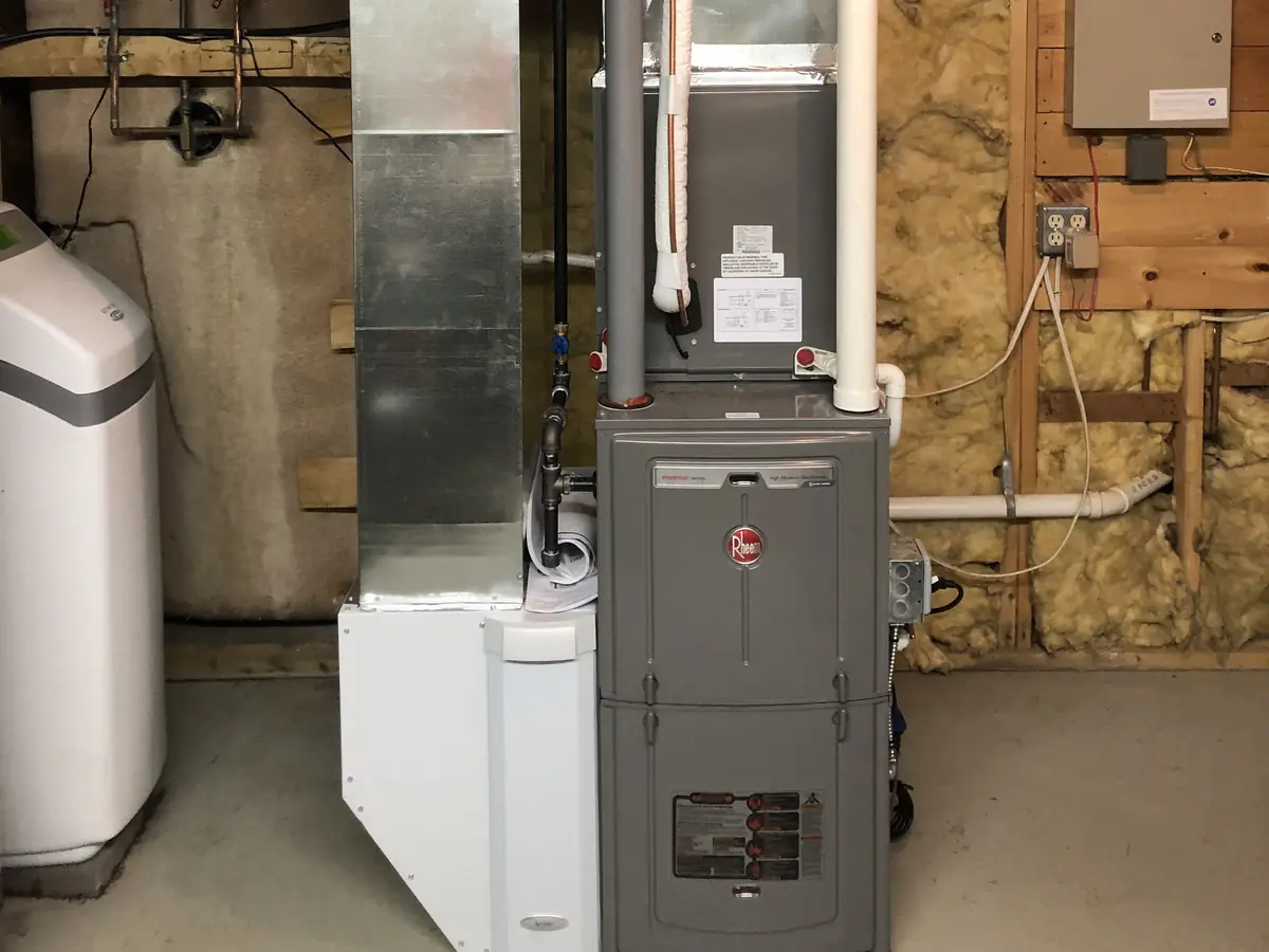 Rheem Prestige 96% AFUE condensing gas furnace installation in a Southern NH basement