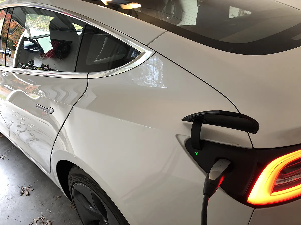 Tesla Model 3 charging at a Level 2 home EV charger installed by A.J. LeBlanc Heating in Southern NH