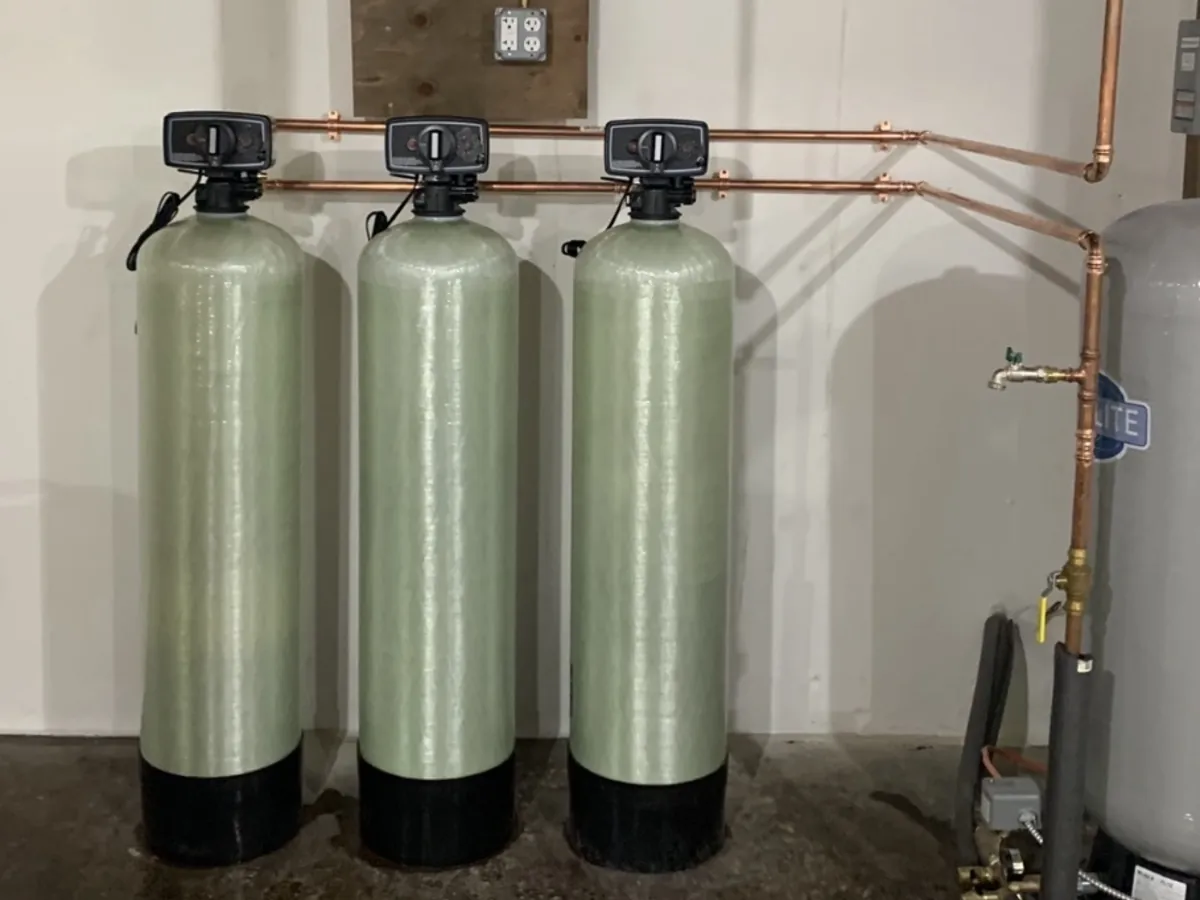 Three-tank well water filtration system installed by A.J. LeBlanc Heating in Southern New Hampshire