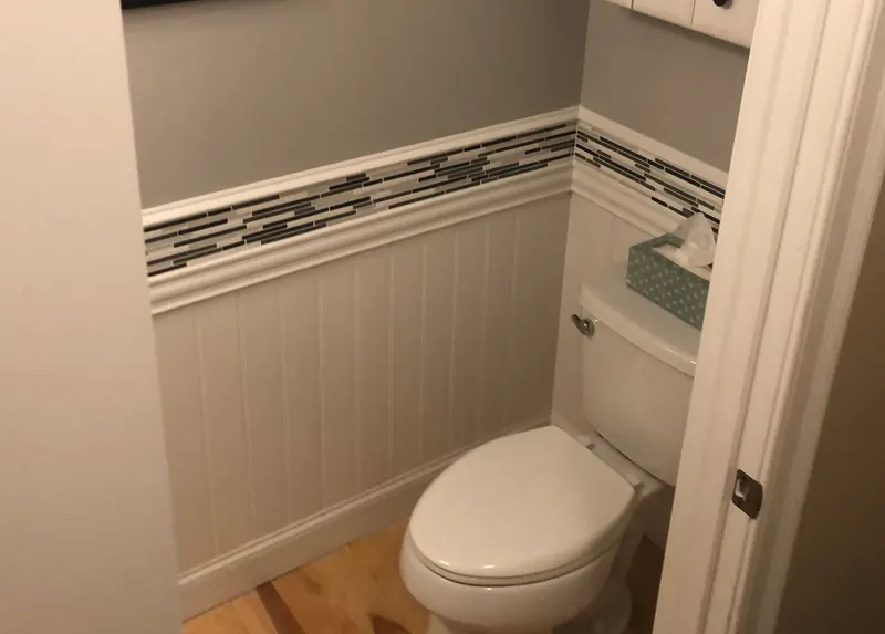 Powder room toilet with board and batten wall