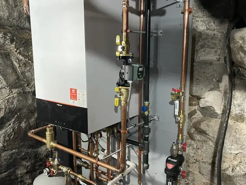 Viessmann wall-hung condensing boiler installation in a Southern NH home with stone foundation