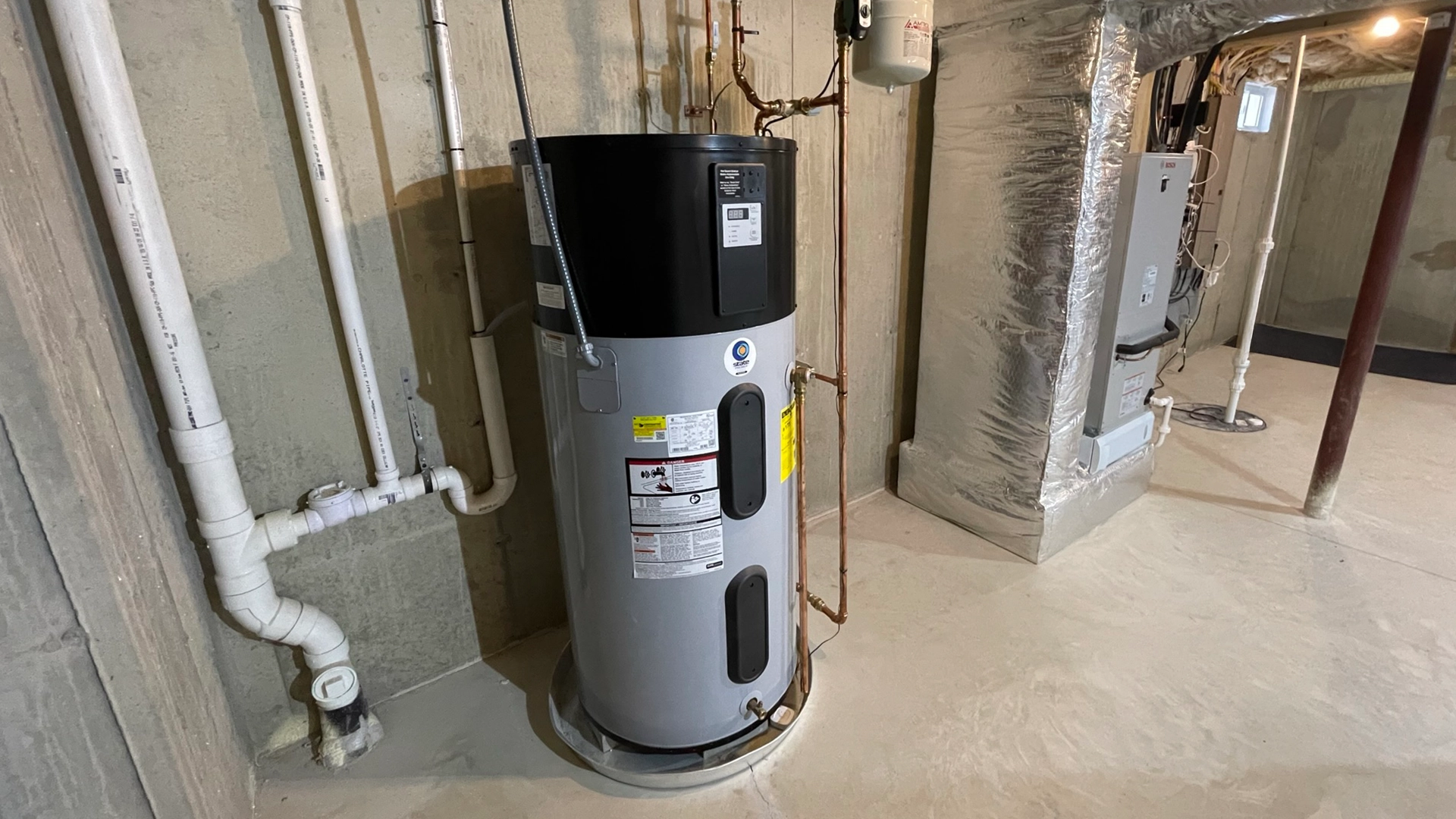 Heat pump water heater installed in a New Hampshire basement by A.J. LeBlanc Heating
